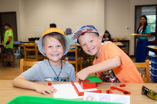 two boys building lego