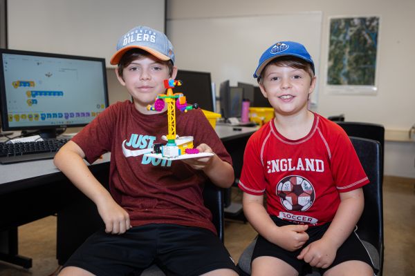 two boys with lego project