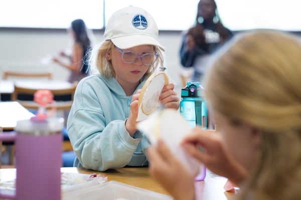 Girl doing needle point
