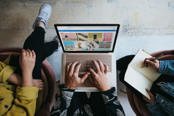 group of students working on a laptop