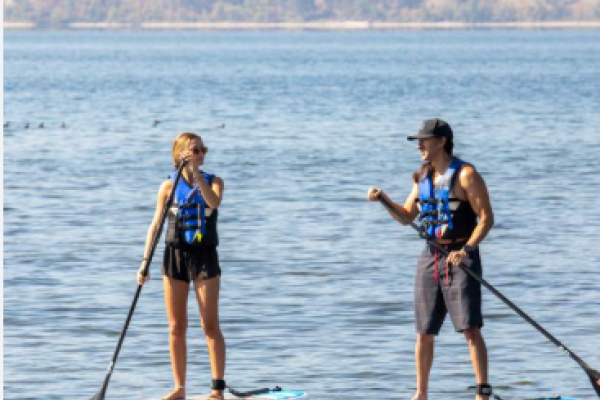 two people on paddle boards 