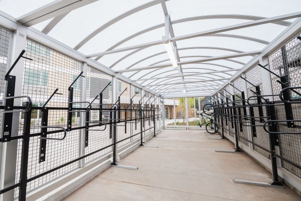 Dedicated bike storage area featuring wall-mounted bike racks for hanging and securely storing bicycles when not in use.
