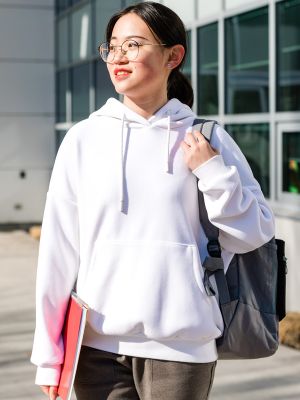 female international student walking outside the Centre for Learning building at the Kelowna Campus