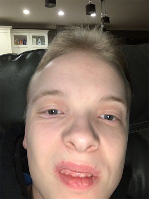 a selfie of a young man on a couch