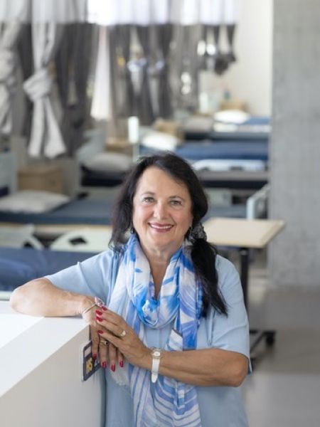 Jane Hoffman Standing in Nursing Lab