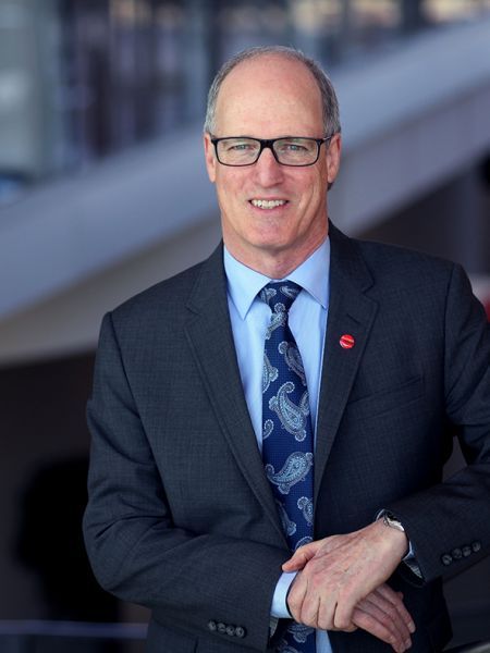 Photo of Jim Hamilton standing on stairs