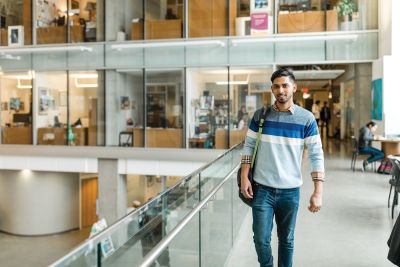 A student walking at Okanagan College