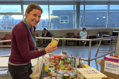 An OC employee drops off food donations on Giving Tuesday