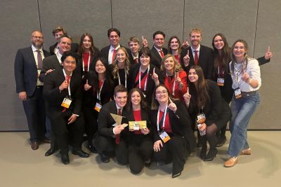 Enactus group photo. Students smiling together