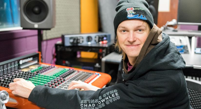 male student in audio engineering room