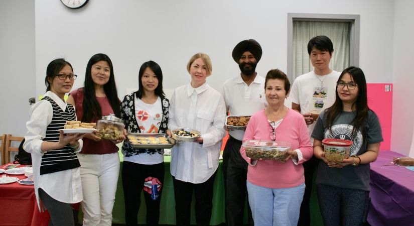 English language students offer up their potluck-style dishes to the class, and then present on the cultural significance of the dish.