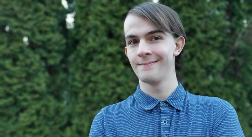 Ayden Clark, Business student in Salmon Arm wearing a blue button up shirt