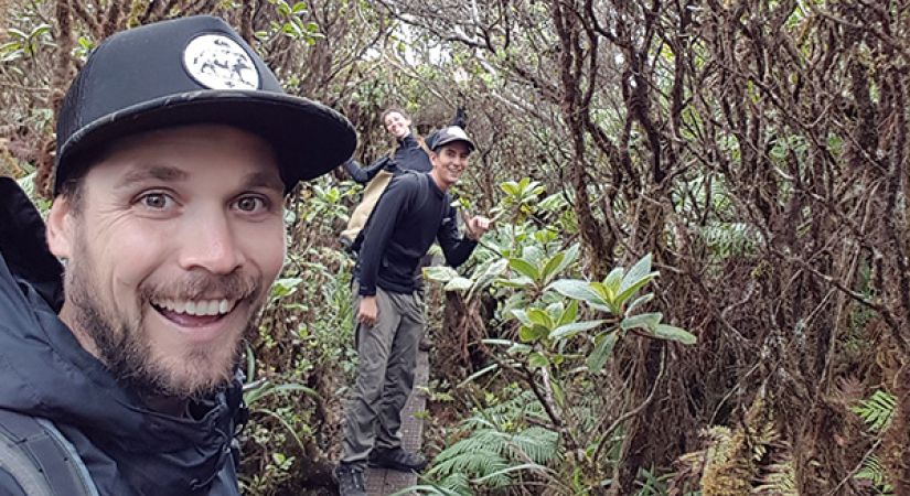 Cam Egan hiking Mount Kaala with two friends