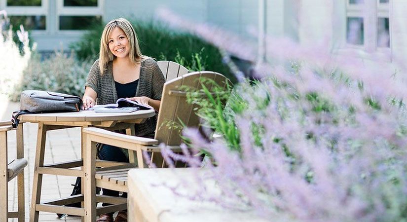 Sophie Wilson sitting at a table studying