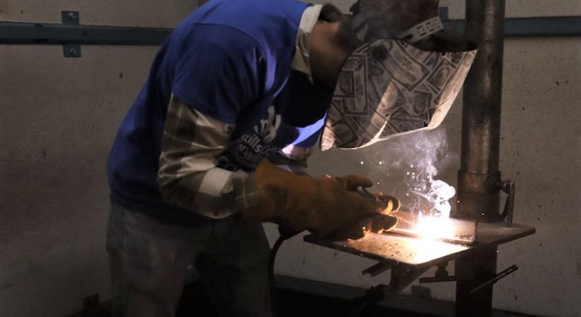 A student welding at Okanagan College