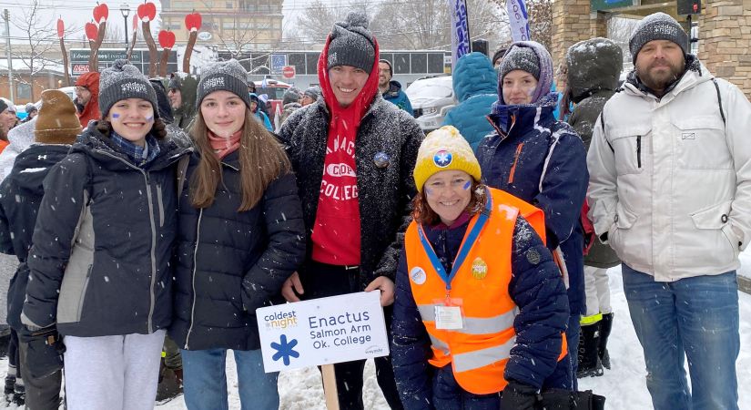 Six students bundled up in winter gear fundraise during Coldest Night of the Year.