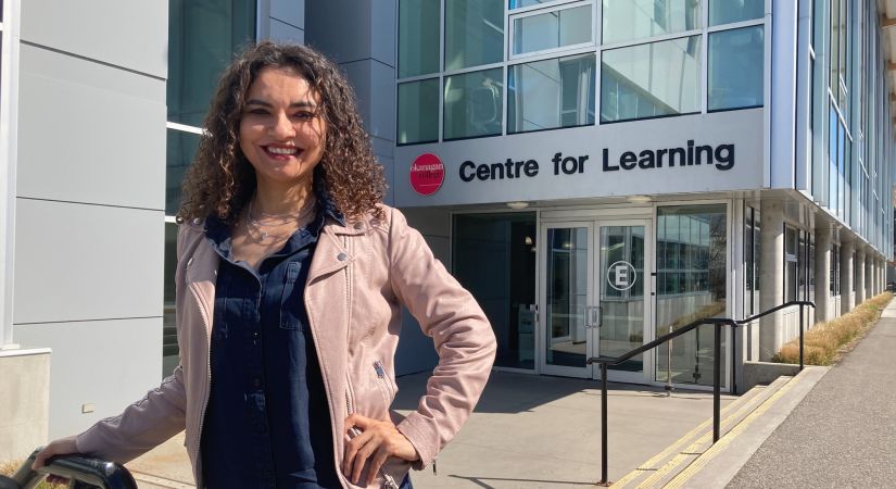 Communications student standing outside the Centre for Learning building at the Kelowna campus