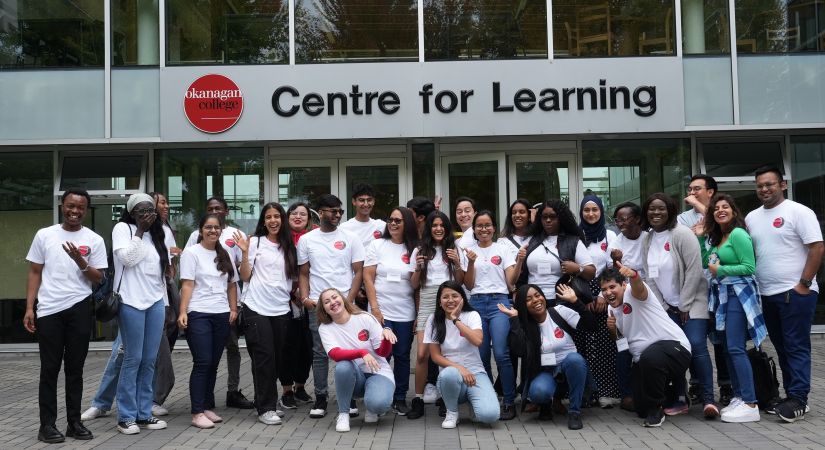 group of students standing outside an Okanagan College building at the Kelowna campus