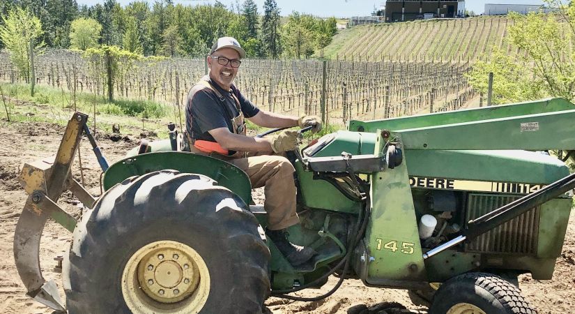 Person smiling on a tractor