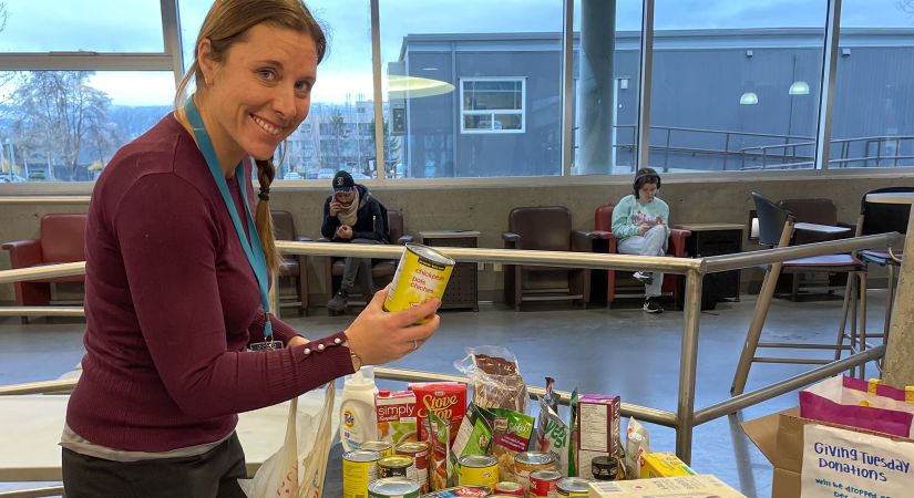 An OC employee drops off food donations on Giving Tuesday