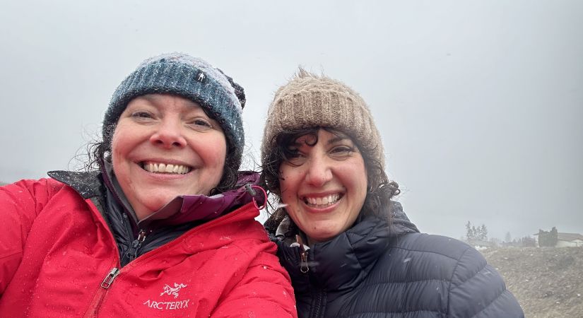 Linda O’Donoghue (right) and Deidre Craig. wearing jackets and hats, smiling outside.