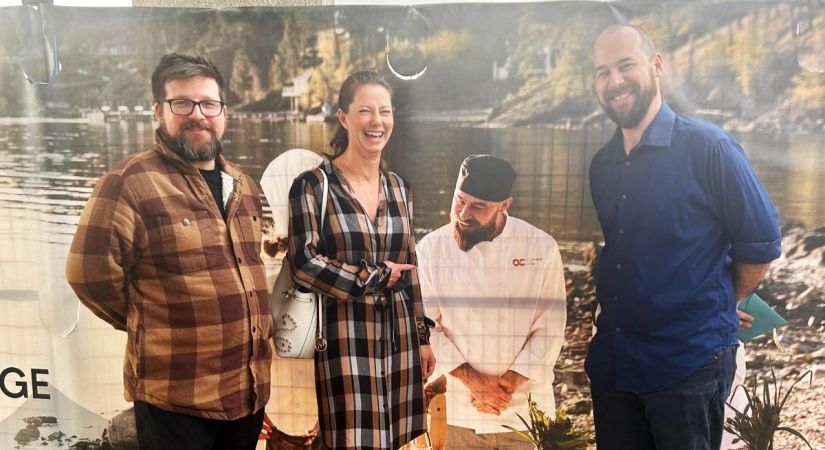 Josh, Jennifer and Nathan standing in front of the Centre for Food, Wine and Tourism banner