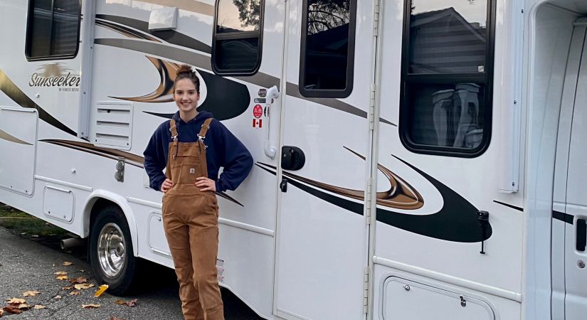 Katelyn DiMarcello standing in front of an RV