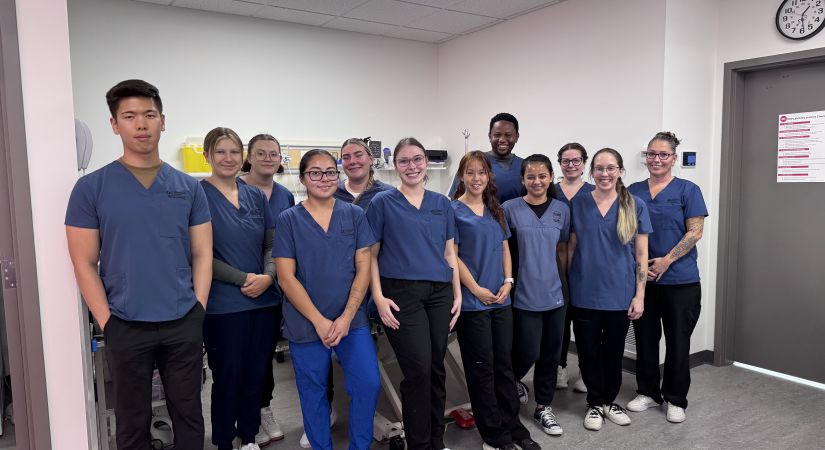 Okanagan College Nursing students wearing scrubs smile
